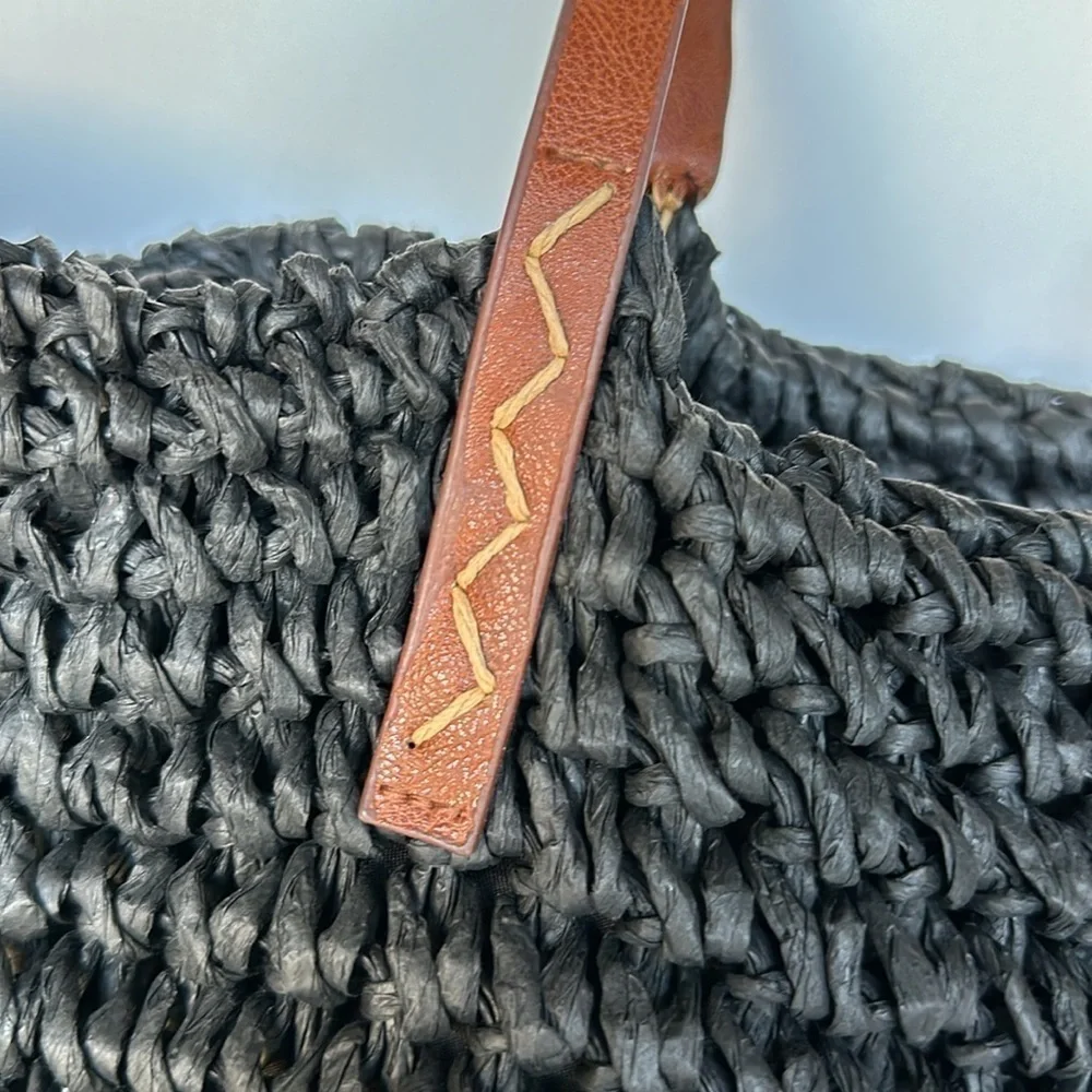 Kenneth Cole straw bag in back with tan straps